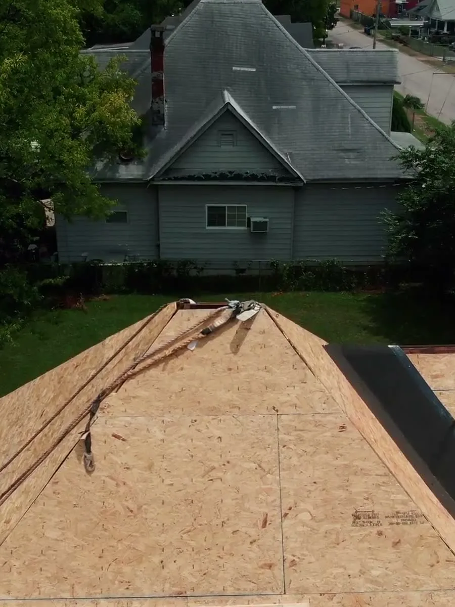 Fresh roof decking on a home surrounded by trees