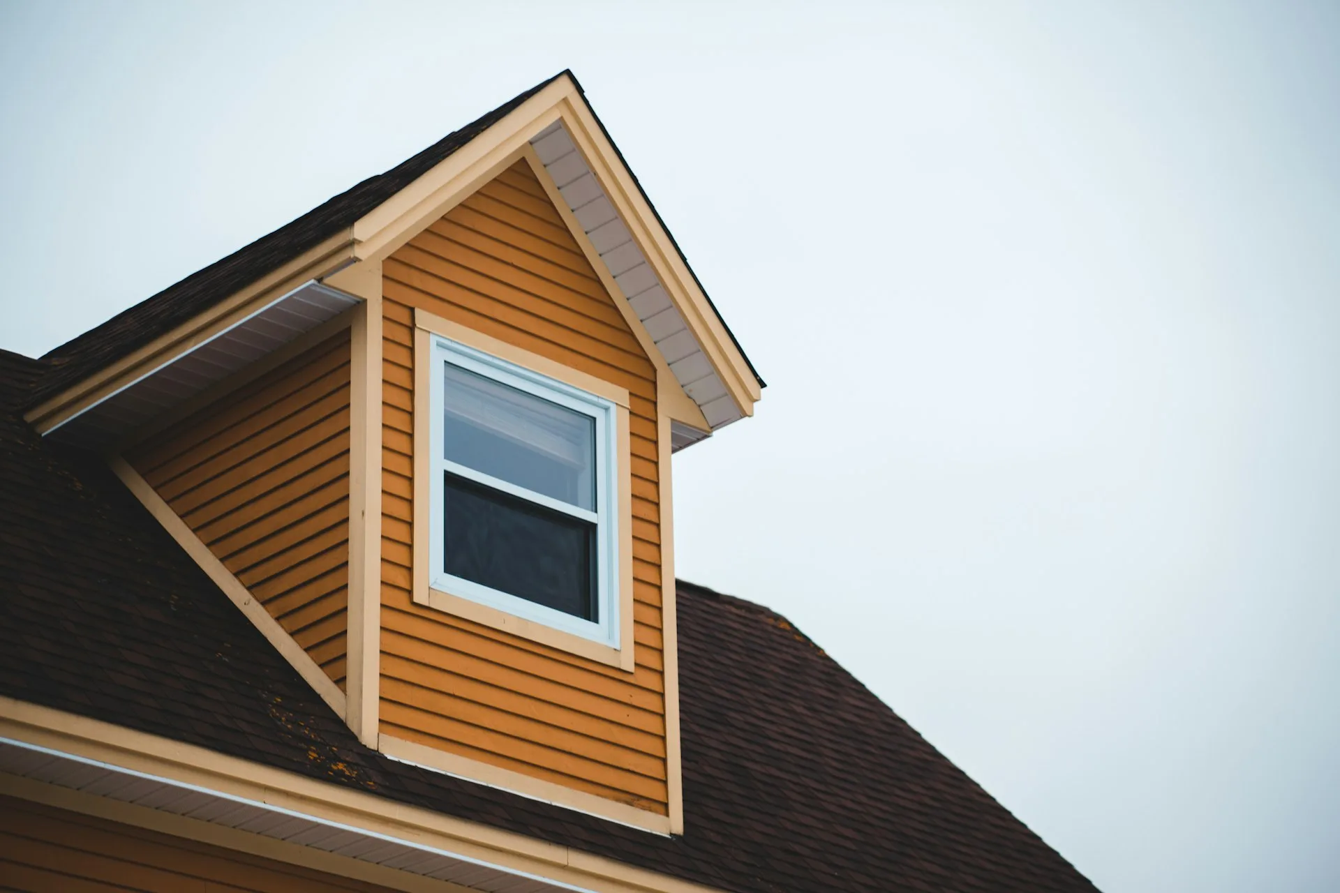Warm wood-look siding on a dormer