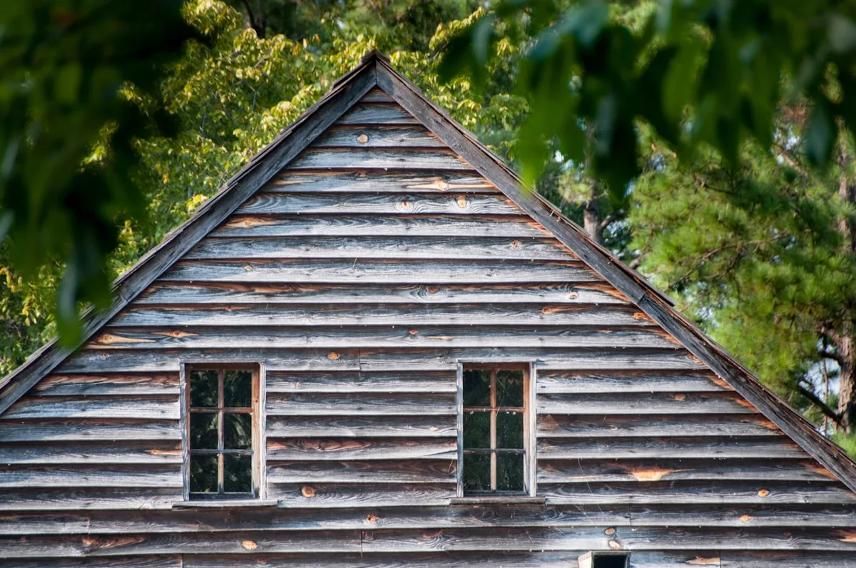 Weathered wooden house before re-siding